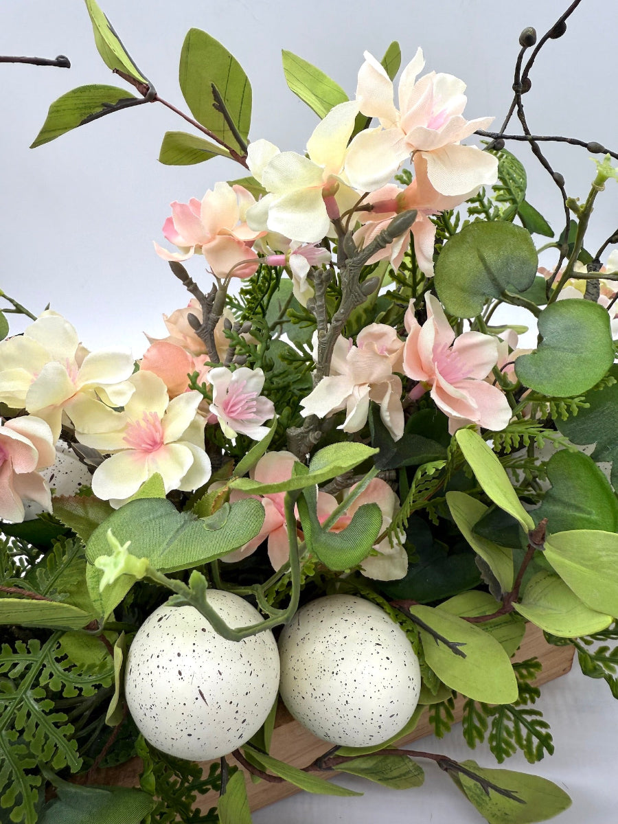 Easter arrangement with Cherry Blossom branches, faux eggs and greenery