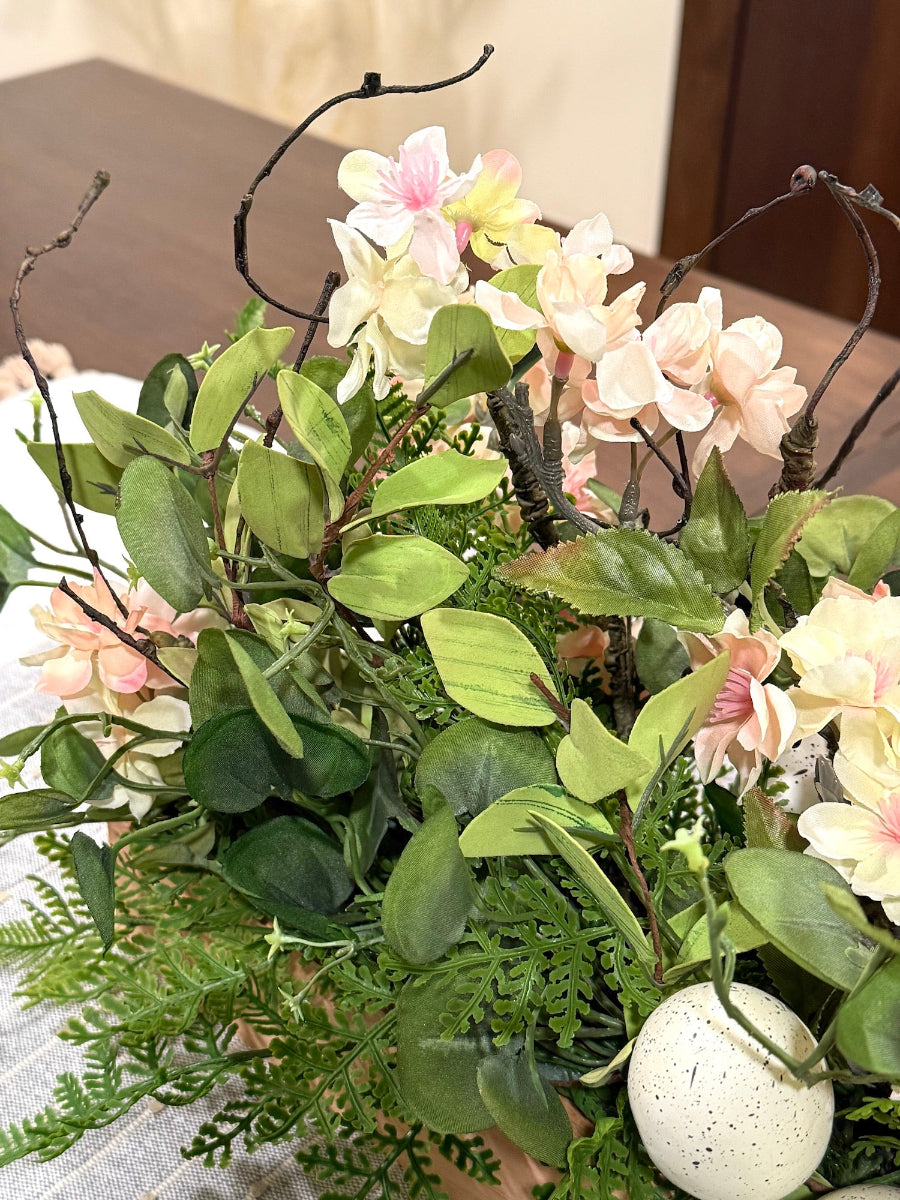 rich greenery cherry tree blossom faux eggs in wooden planter