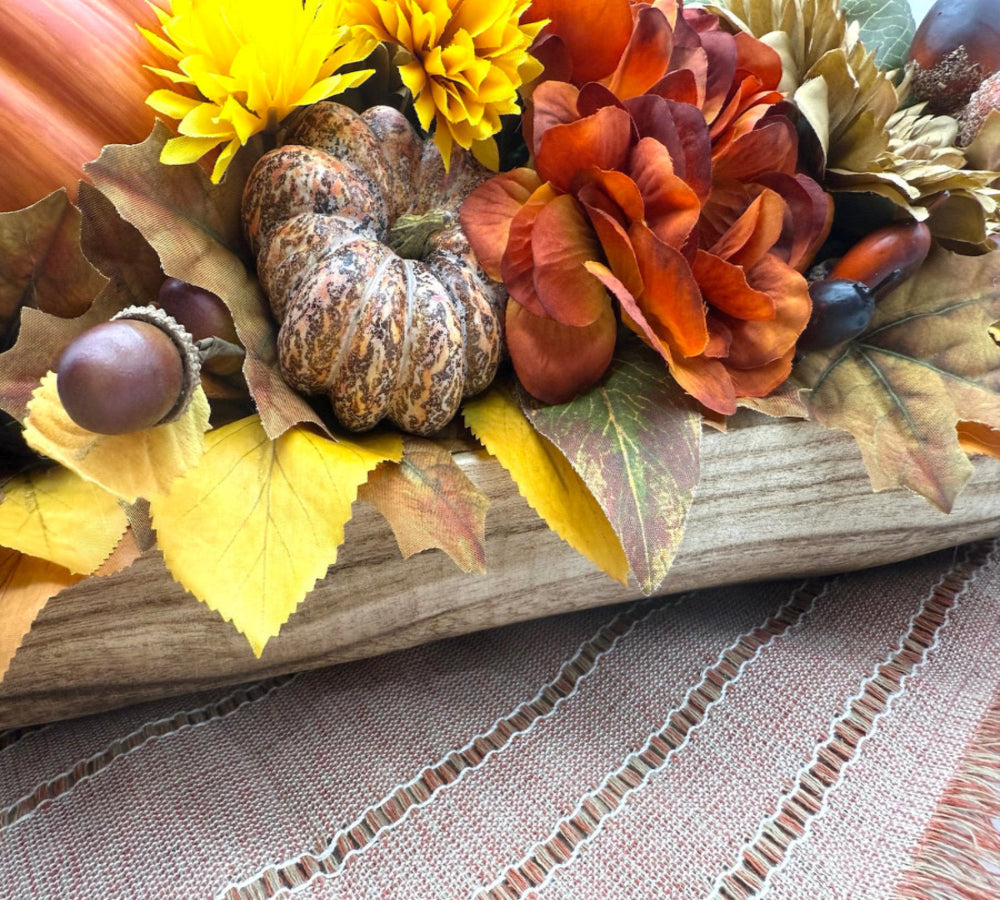 Harvest Centerpiece with fall flowers, pumpkins and berries in wooden long bowl in modern farmhouse style