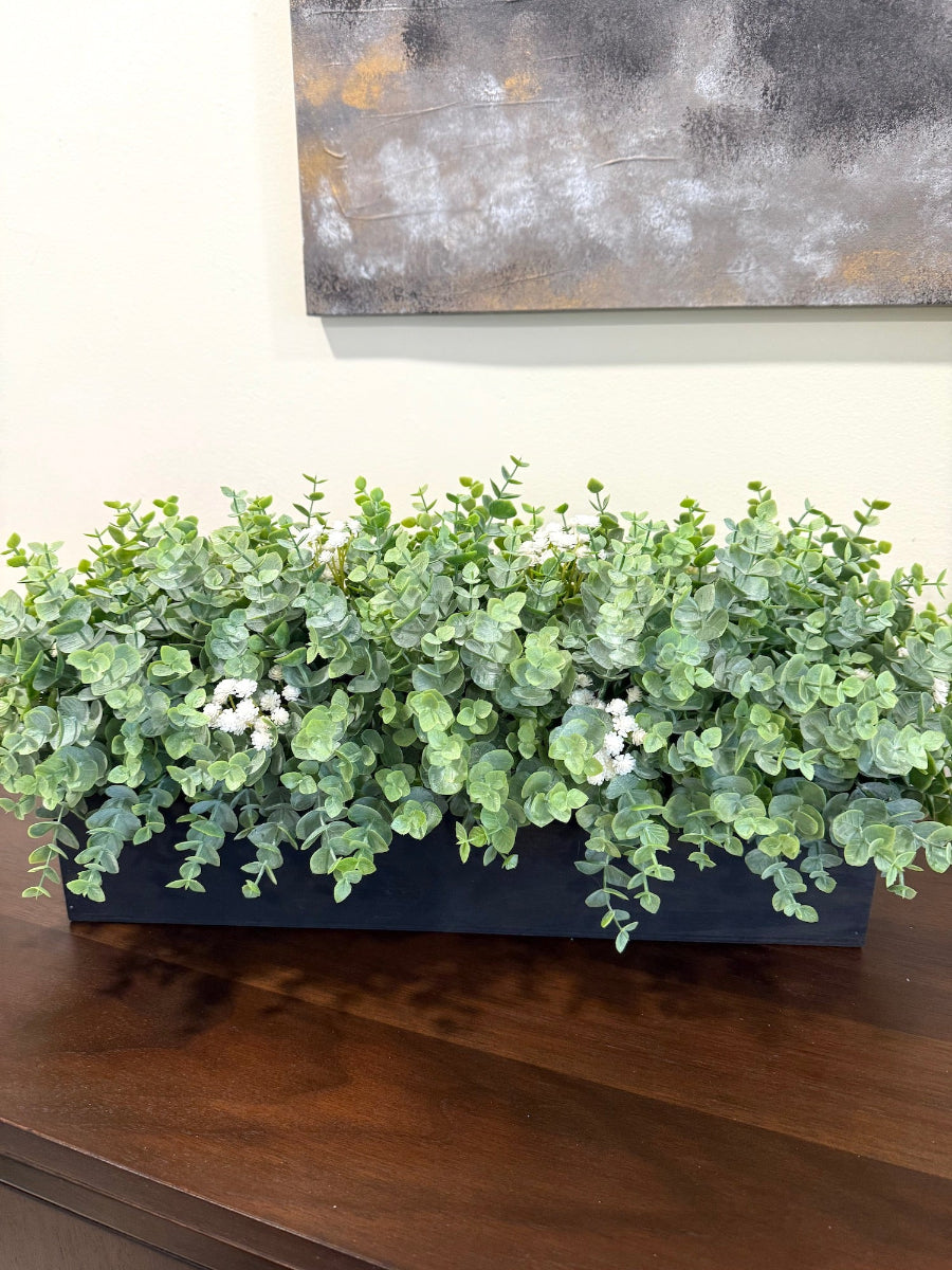 lush lifelike fauxeucalyptus arrangement in black wooden planter
