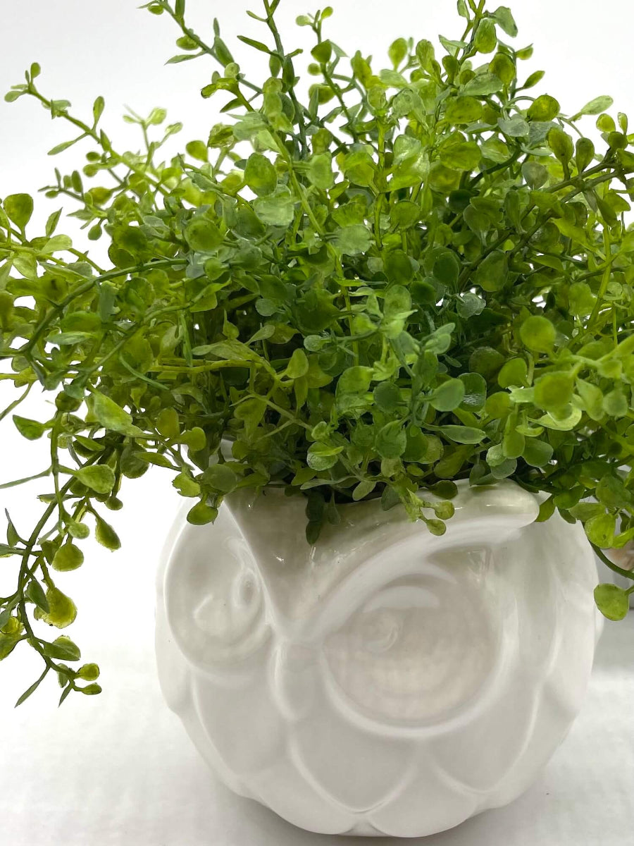 lush vivid green Fake Plant in White Ceramic Owl Pot