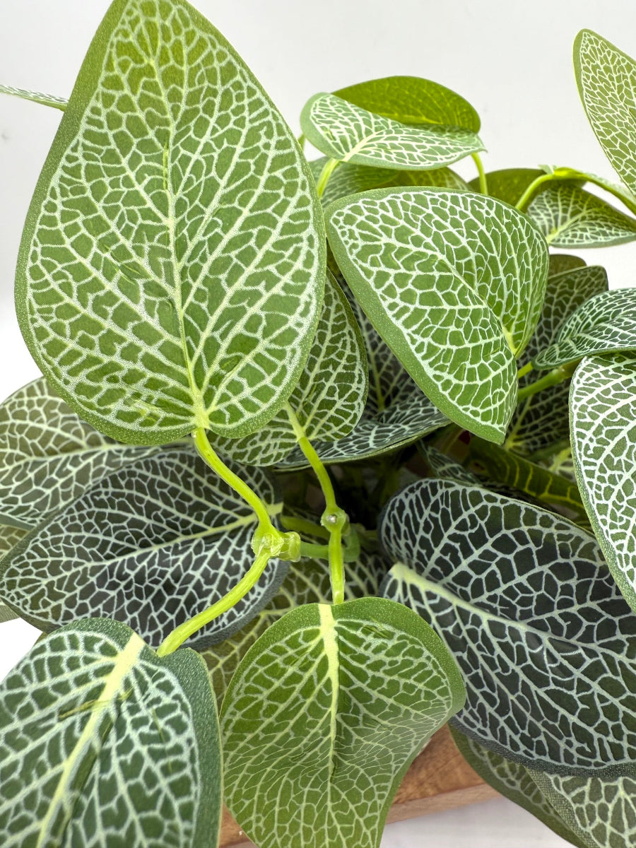 realistic green leaf faux plant is square ceramic white vase