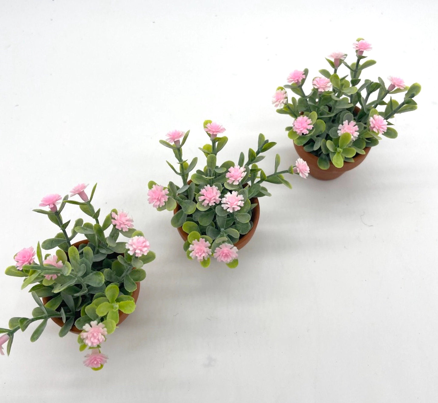 view from top for Mini pink Floral Arrangements set of 3 in clay pots