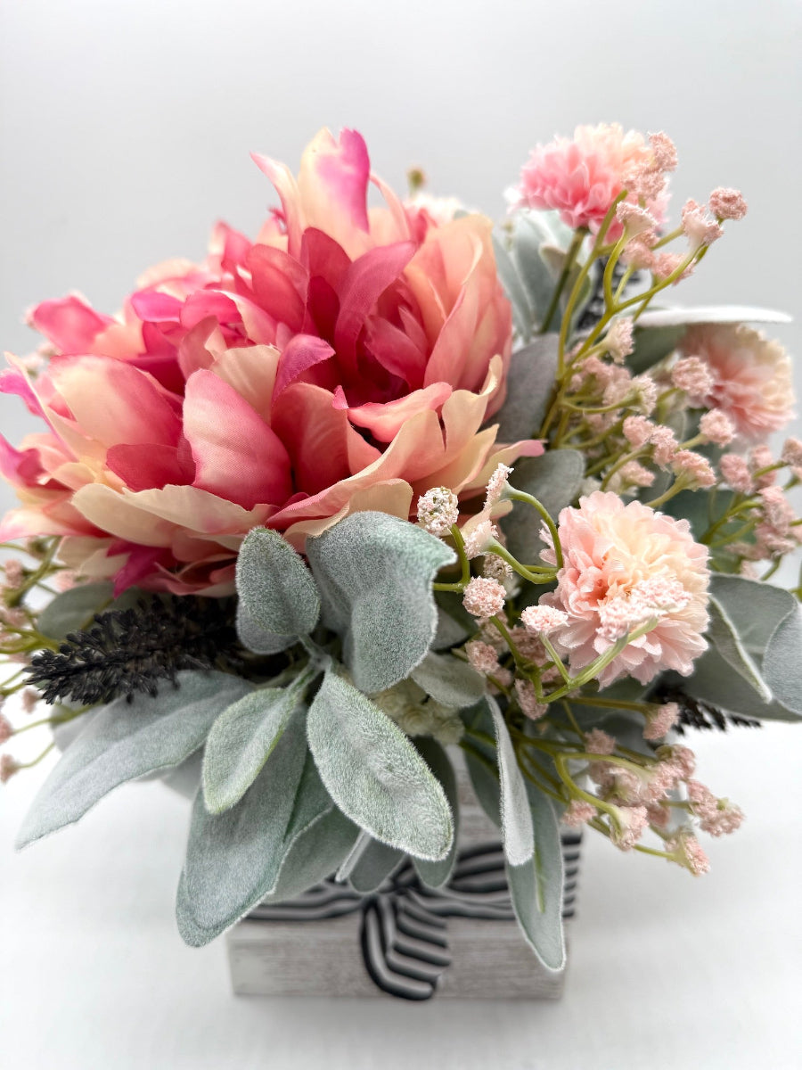 pink flower arrangement with peony and lams ear in whitewashed wooden vase