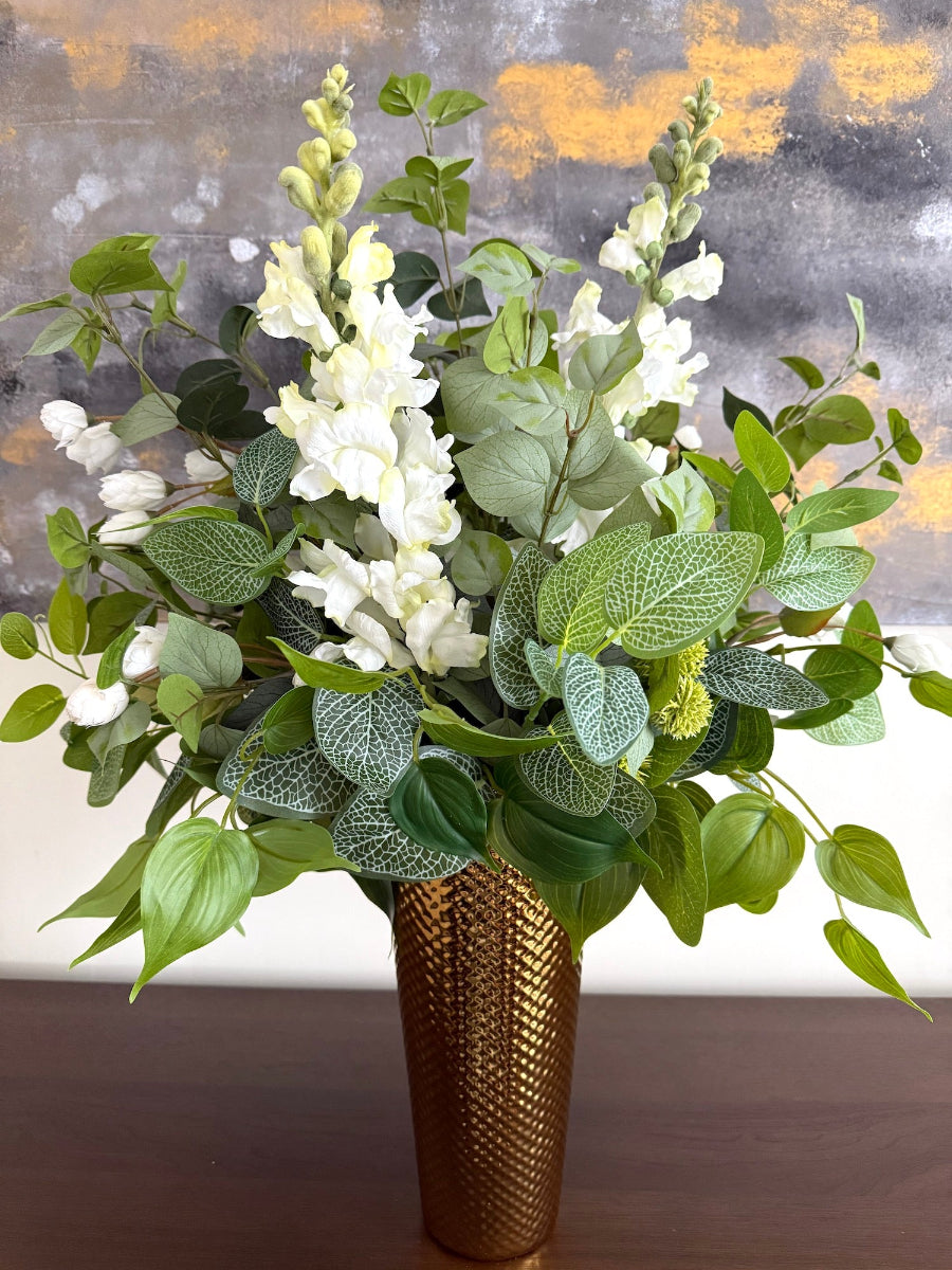 variety of greenery stems and white flowers bouquet, lush and pretty tall gold vase