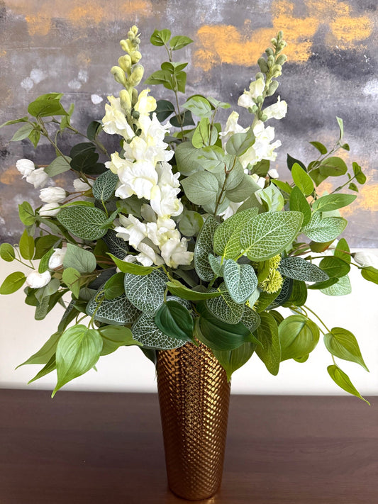 variety of greenery stems and white flowers bouquet, lush and pretty tall gold vase