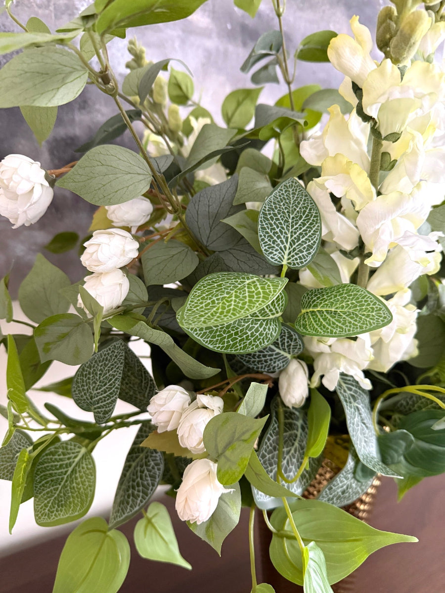 fresh looking greenery arrangement with white flowers