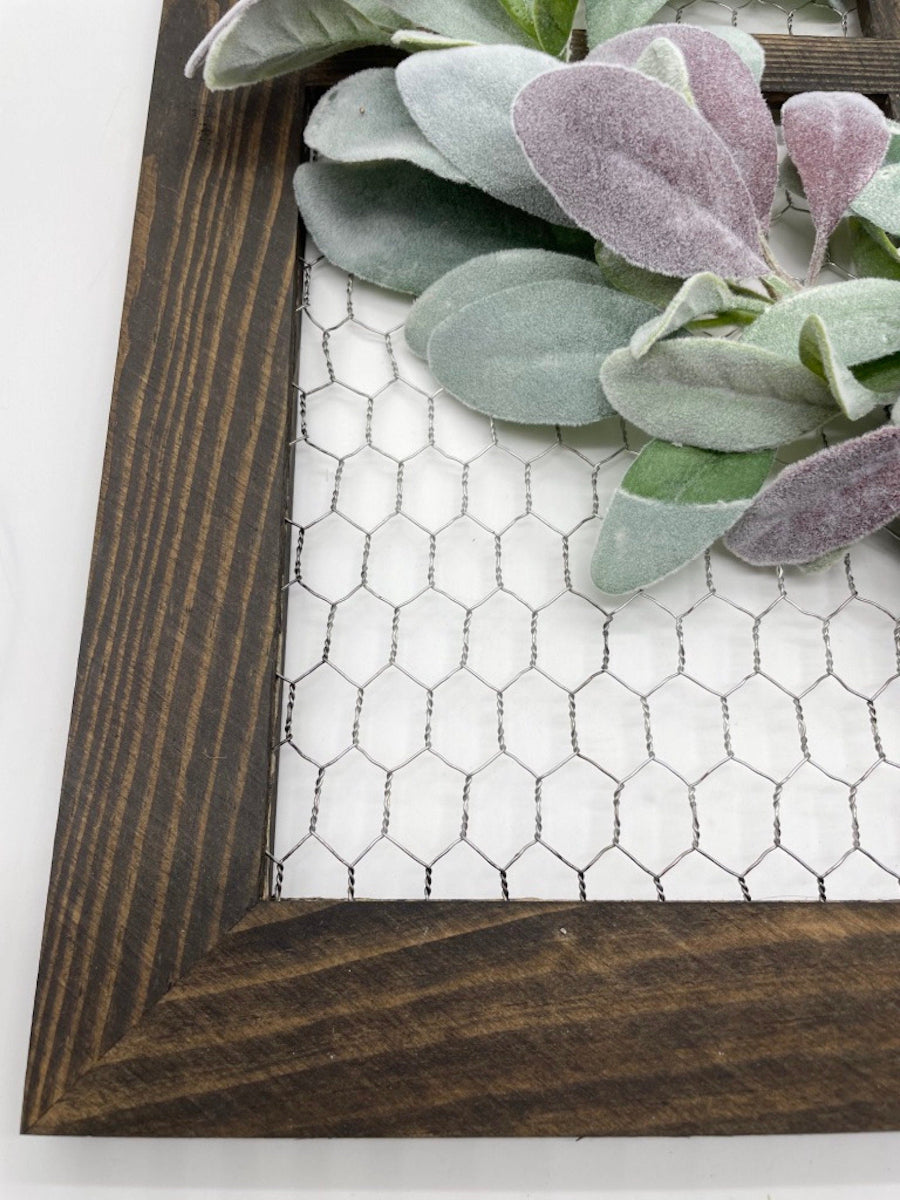 decorative wooden frame witch chicken wire