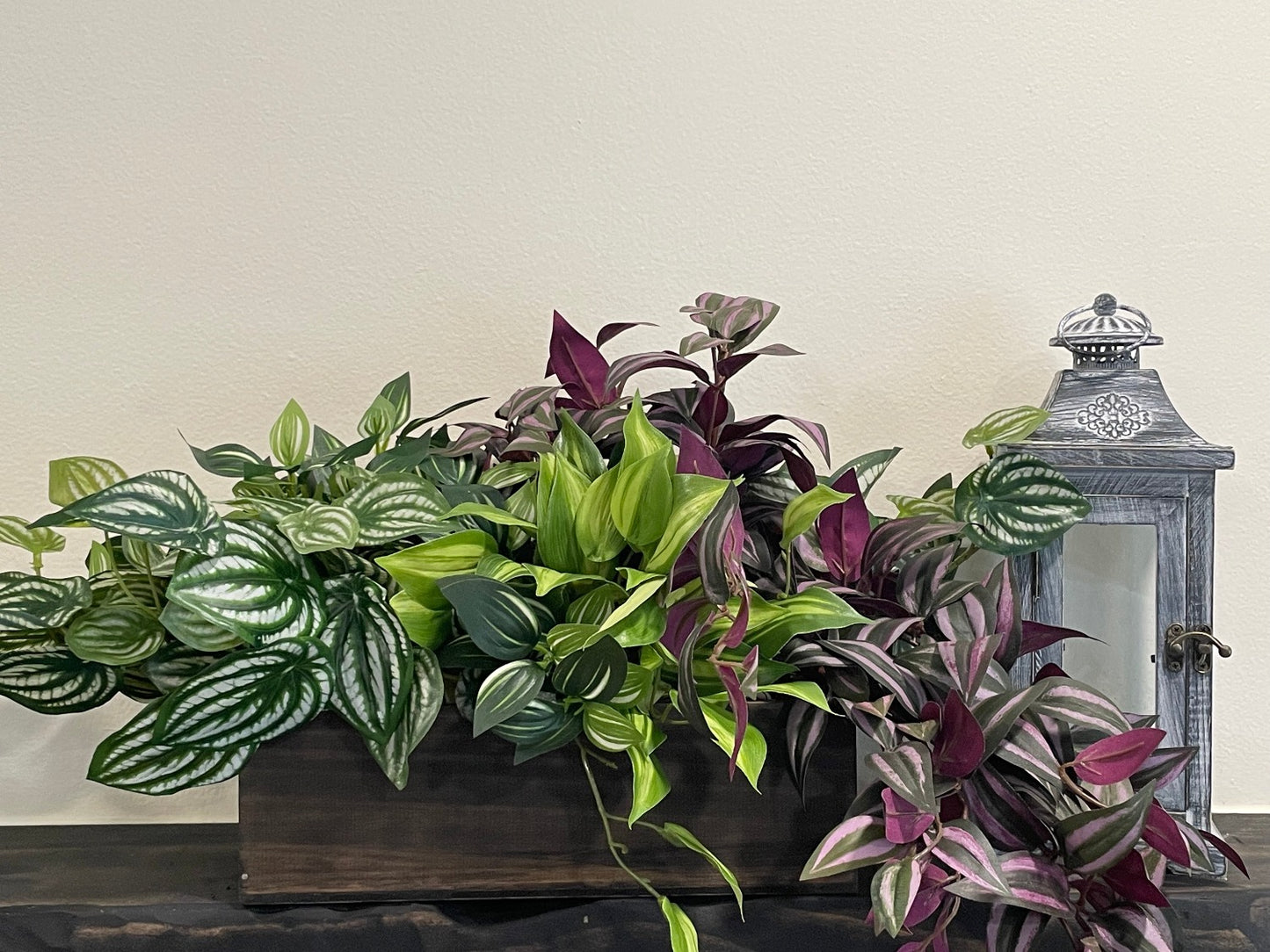 realistic faux plants arrangement, four types o green, green-white, burgundy plants in wooden planter stained in expresso color