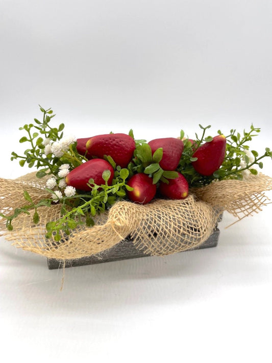 realistic Artificial Strawberry in wooden crate in gray or white decorated with greenery, white flowers and burlap