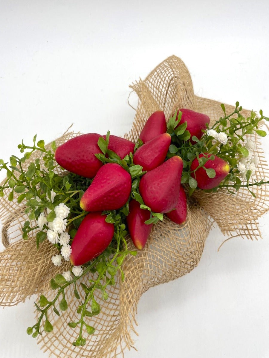 view from top realistic Artificial Strawberry in wooden crate in gray or white decorated with greenery, white flowers and burlap