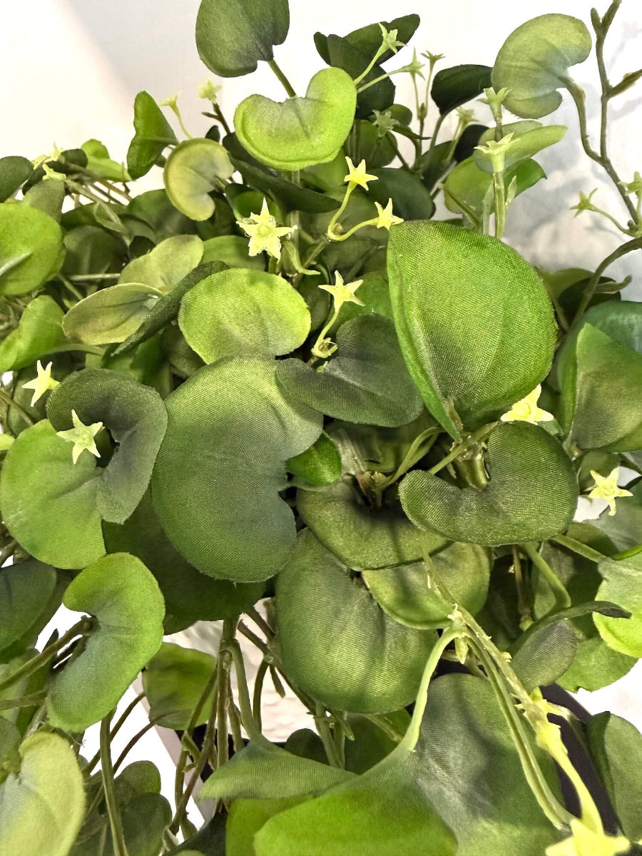 close up for realistic looking faux greenery with fabric leaves in white eramic textured pot