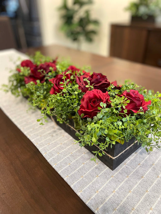 realistic deep red roses and vivid greenery in  wooden planter stained is expresso color
