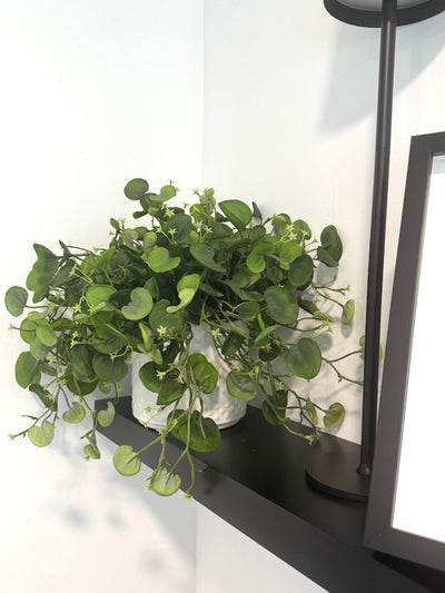 realistic looking faux greenery with fabric leaves in white eramic textured pot