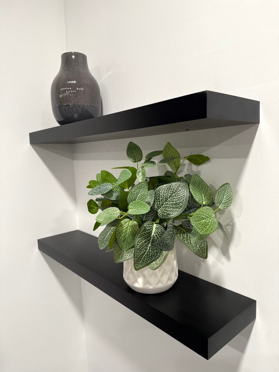 faux plant green white leaves in white ceramic pot vase