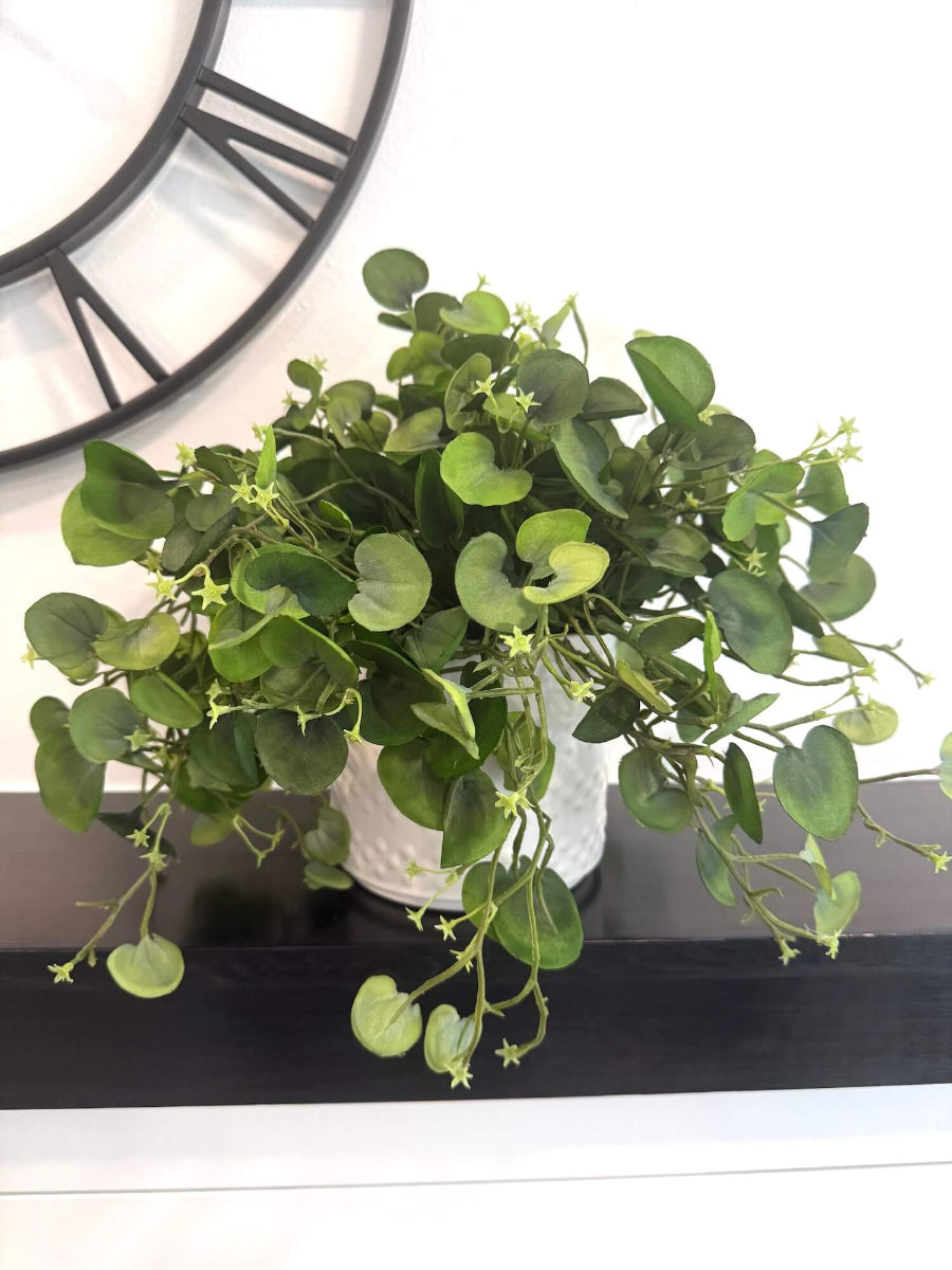 realistic looking faux greenery with fabric leaves in white eramic textured pot