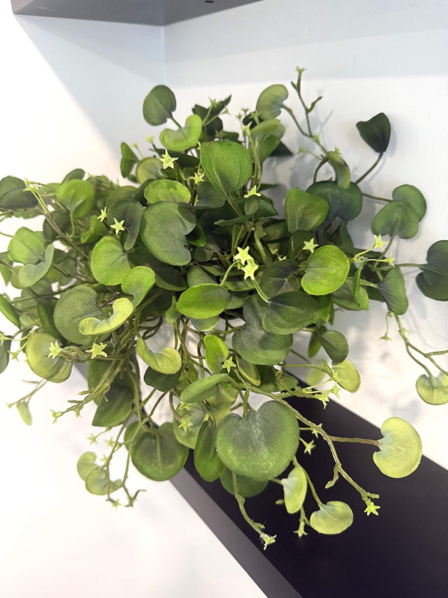 realistic looking faux greenery with fabric leaves in white eramic textured pot