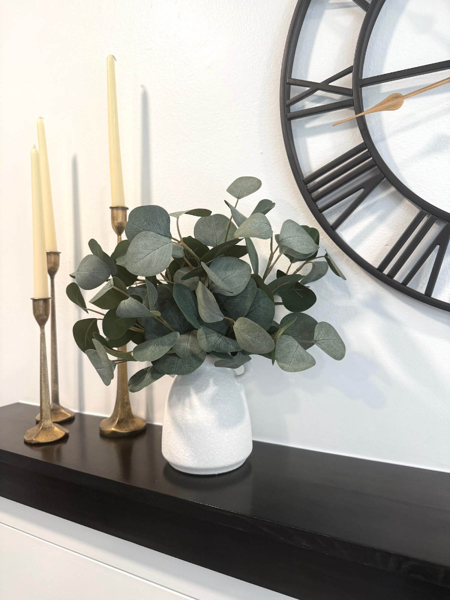 realistic elegant silver dollar eucalyptus arrangement in white matte ceramic textured vase