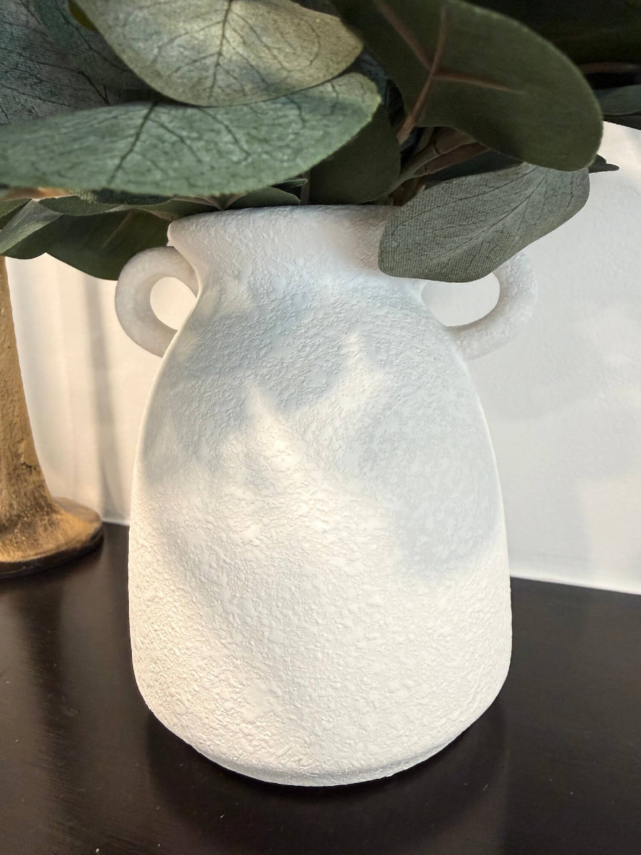 close up for vase: realistic elegant silver dollar eucalyptus arrangement in white matte ceramic textured vase