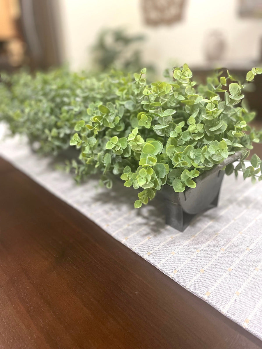 farmhouse style centerpiece with faux realistic looking eucalyptus in metal galvanized long planter