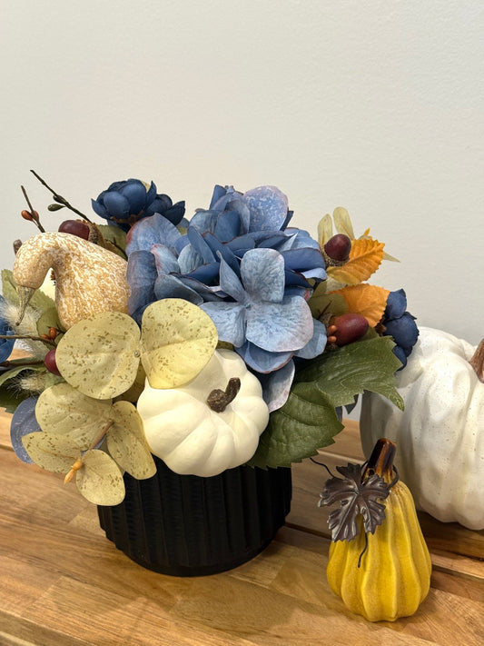 Blue Autumn Floral Arrangement in Black Ceramic Vase with dusty blue hydrangea and white pumpkin