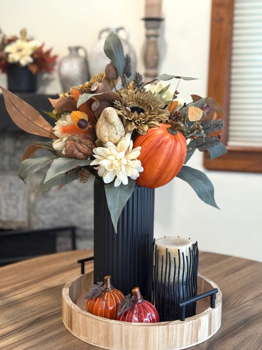 tall harvest arrangement in black ceramic vase with faux pumpkin, autumn flowers and foliage, fall berries