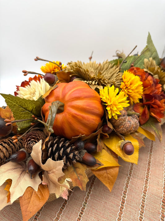 Harvest Centerpiece with fall flowers, pumpkins and berries in wooden long bowl in modern farmhouse style