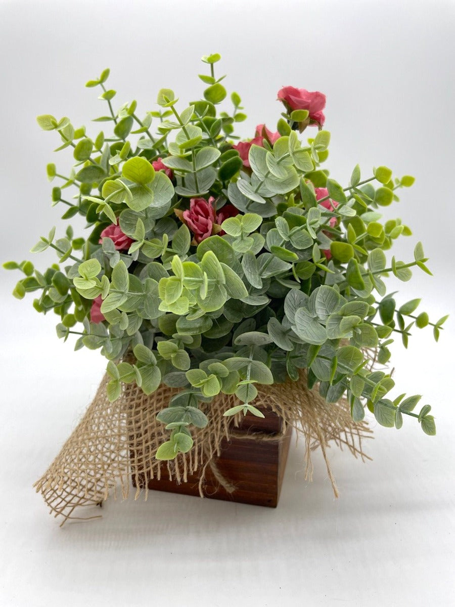 Farmhouse Tray Decor with faux eucalyptus arrangement, wooden bead garland and candle on wooden square tray
