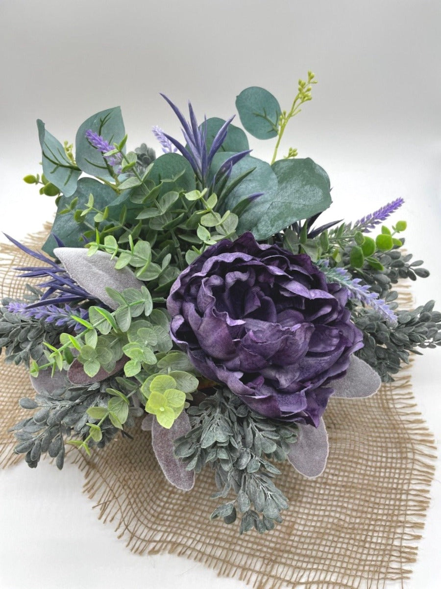 view from top of Purple Floral Arrangement with variety of greenery from green to purple in wooden square planter stained with expresso color