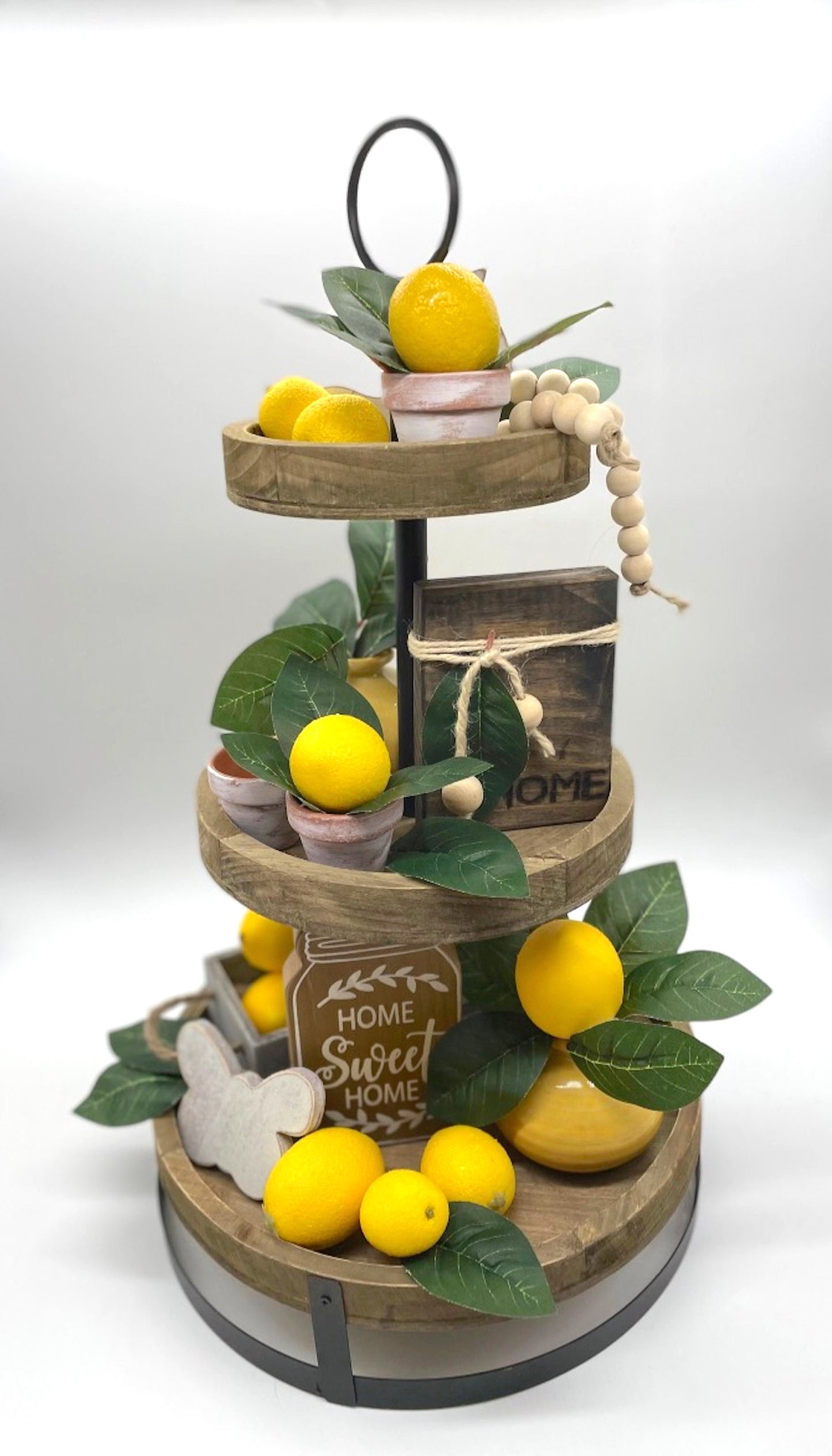 mini faux lemon with lemon leaf arrangement in clay pot touched with white pot for tiered tray decor