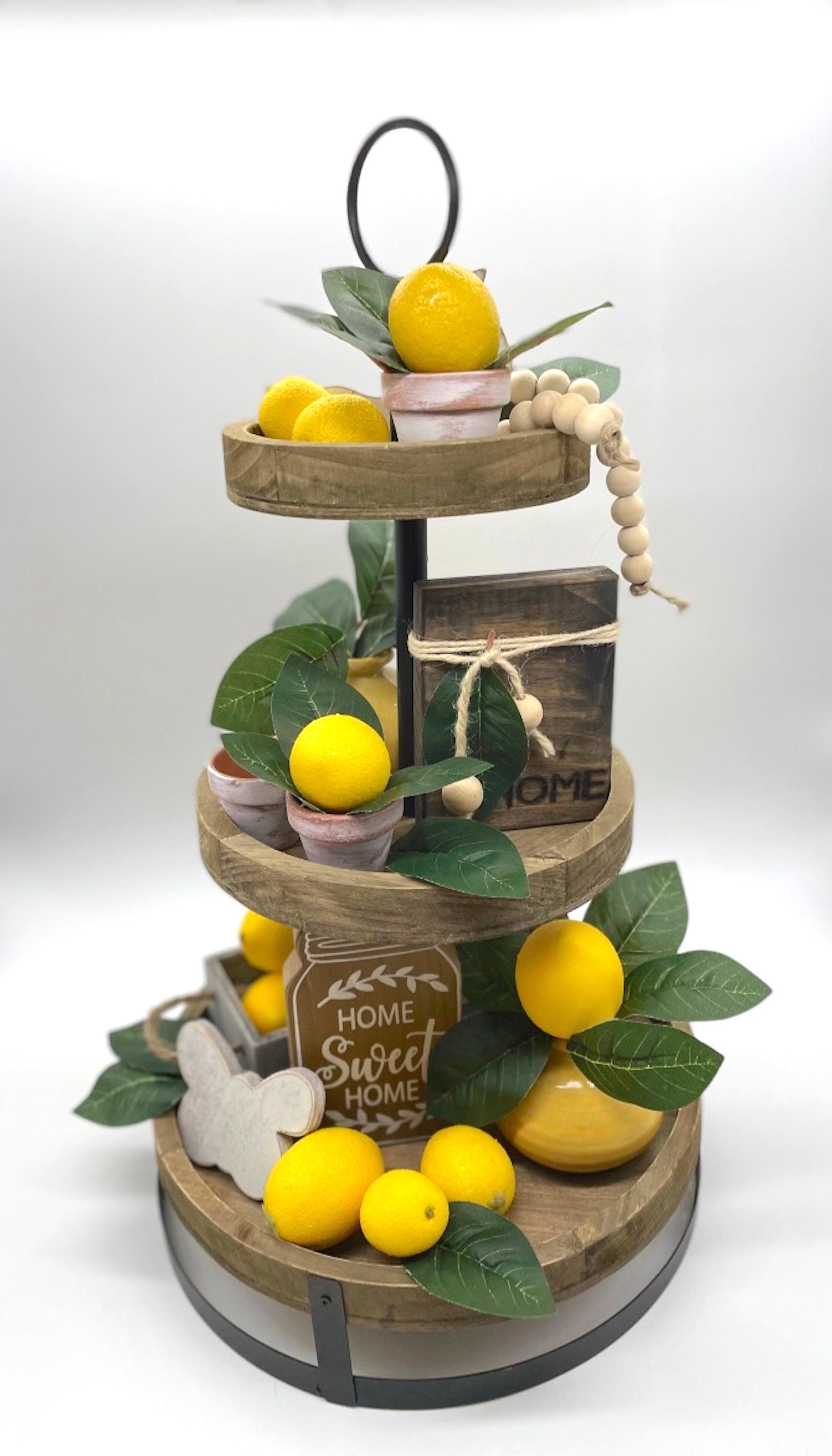 mini faux lemon with lemon leaf arrangement in clay pot touched with white pot for tiered tray decor
