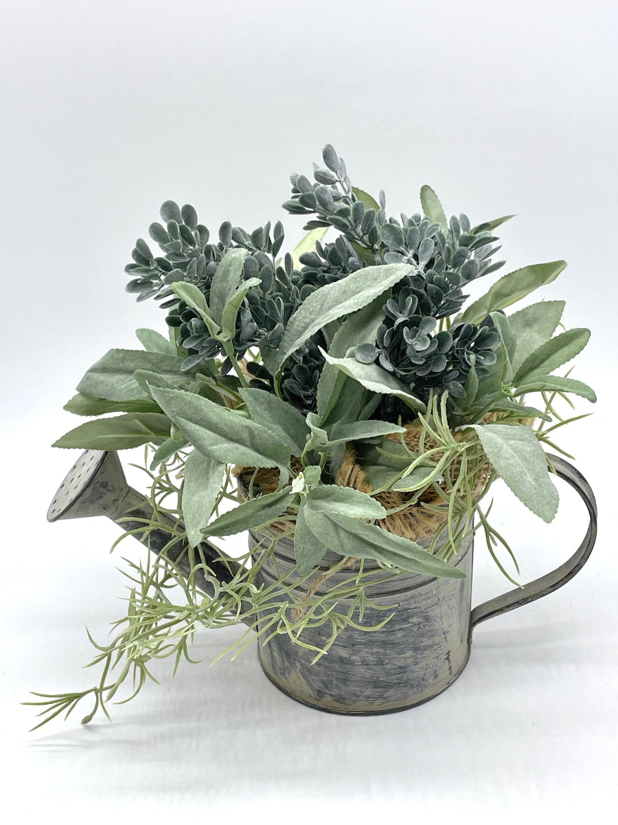 realistic Greenery Arrangement with 3 types of plants in dusty green in Metal Watering Can decorated with burlap and jute