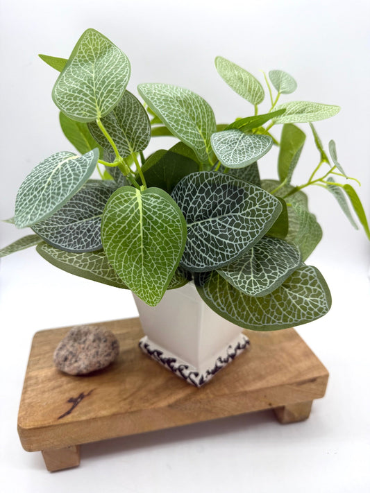 realistic green leaf faux plant is square ceramic white vase