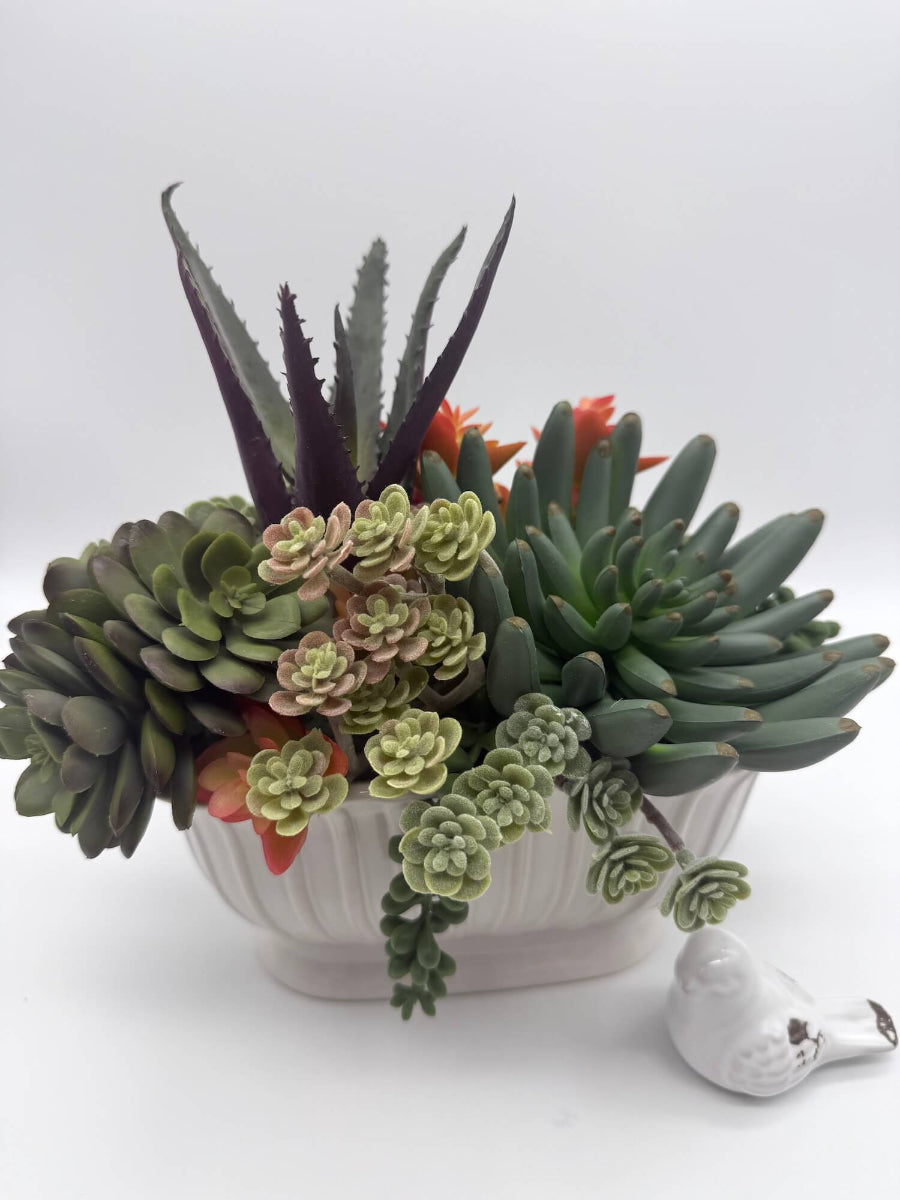 realistic looking faux succulent arrangement in long ceramic textured vase - other side