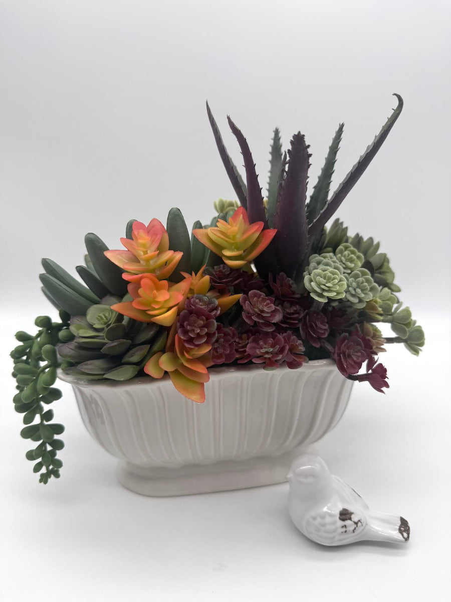 realistic looking faux succulent arrangement in long ceramic textured vase-otherside