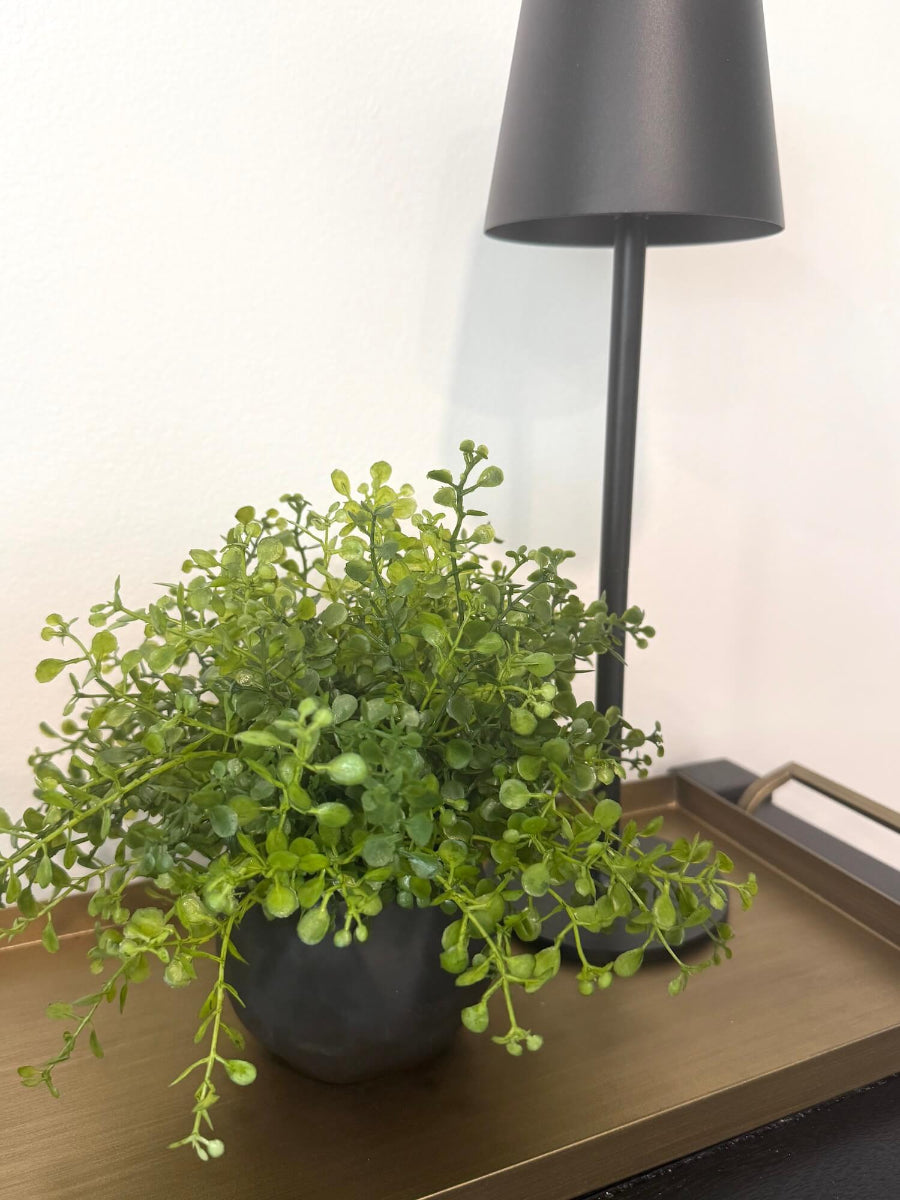 small realistic looking vivid faux greenery in geometric black matte pot vase