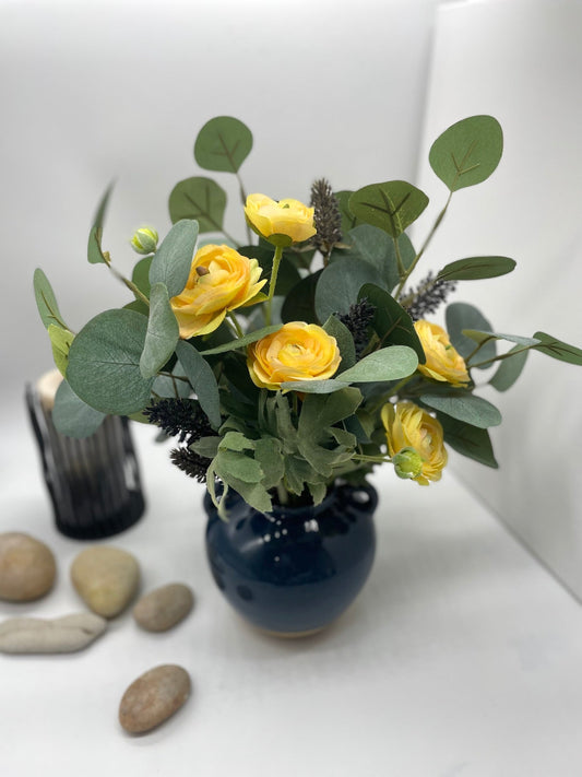 Summer Flower Arrangement with yellow flower, eucalypus stems in navy blue ceramic vase