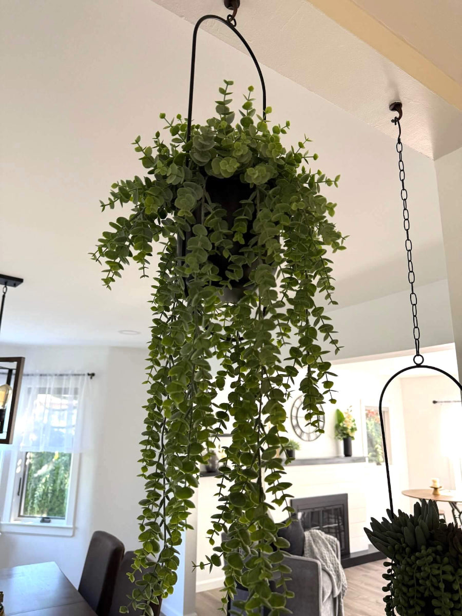 hanging faux eucalyptus plant with cascading stems in modern metal black matte planter