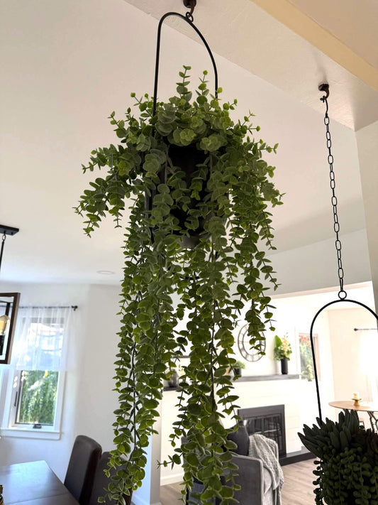 hanging faux eucalyptus plant with cascading stems in modern metal black matte planter