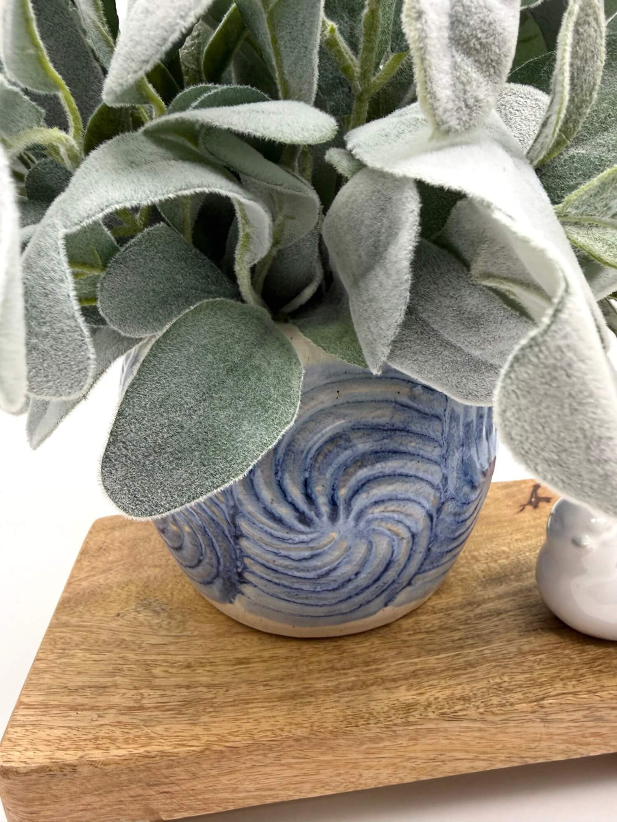 faux lambs ear arrangement in blue ceramic vase for kitchen decor