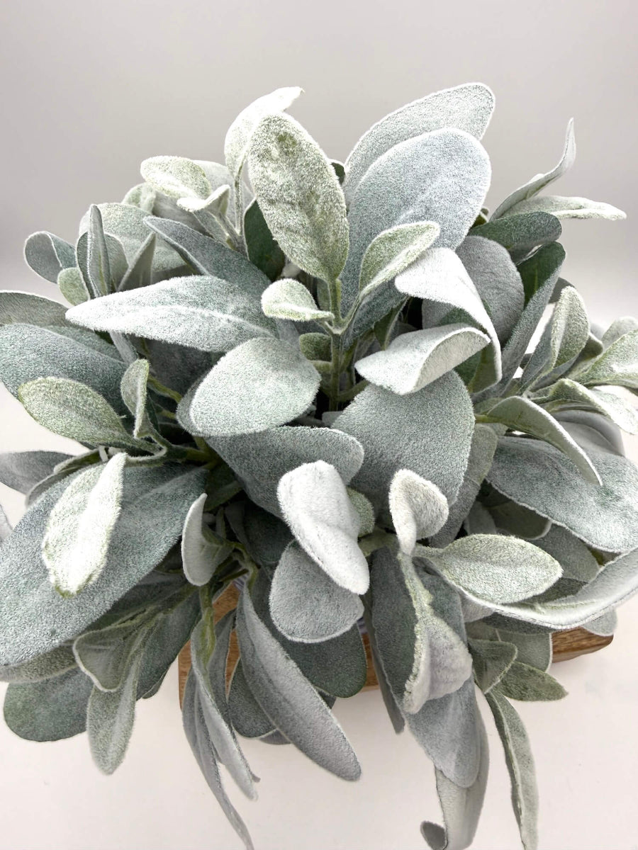 view from top of faux lambs ear arrangement in blue ceramic vase for kitchen decor