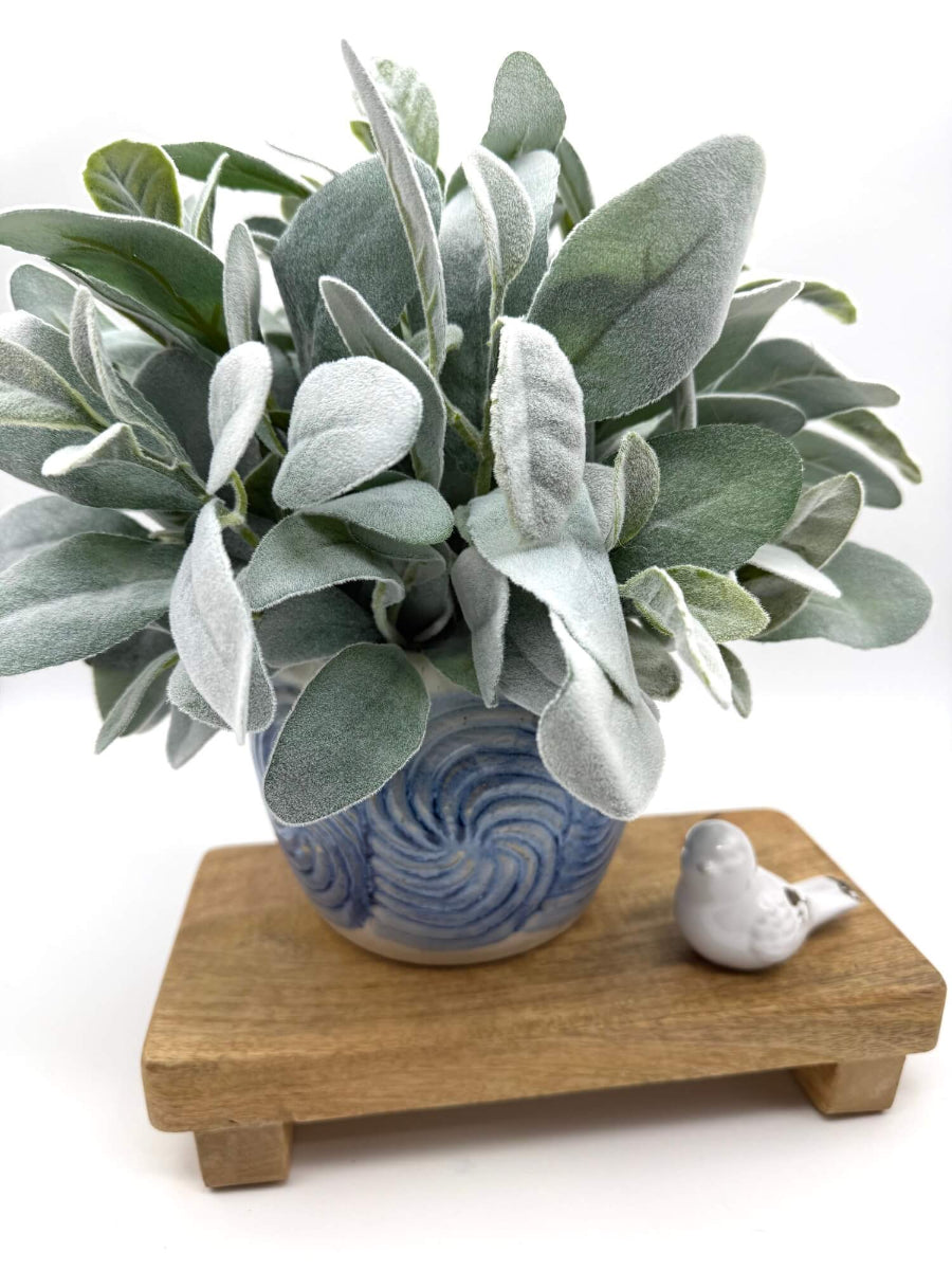 faux lambs ear arrangement in blue ceramic vase for kitchen decor