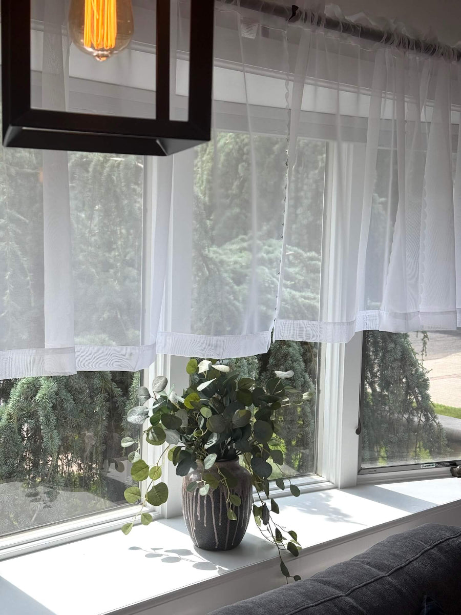 Large realistic looking Faux Silver Dollar Eucalyptus in unique Ceramic Vase styled on bay window