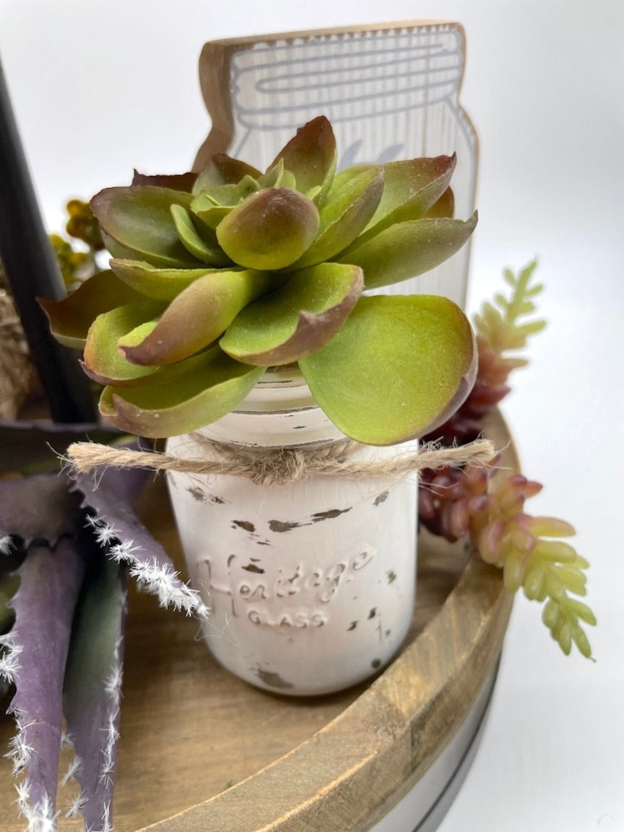 Mini green Fake Succulent in glass jar painted in white and distressed and decorated with jute