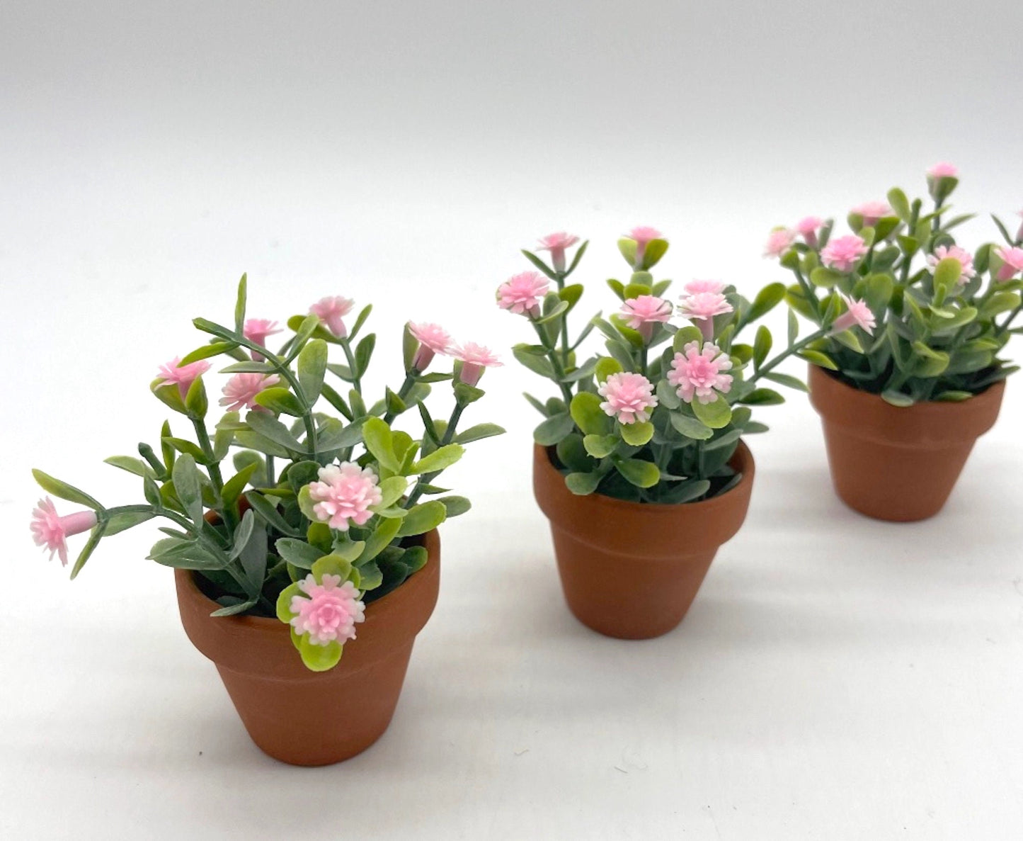 Mini pink Floral Arrangements set of 3 in clay pots