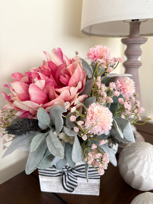pink peony pink and white flower with lambs ear in whitewashed wooden vase