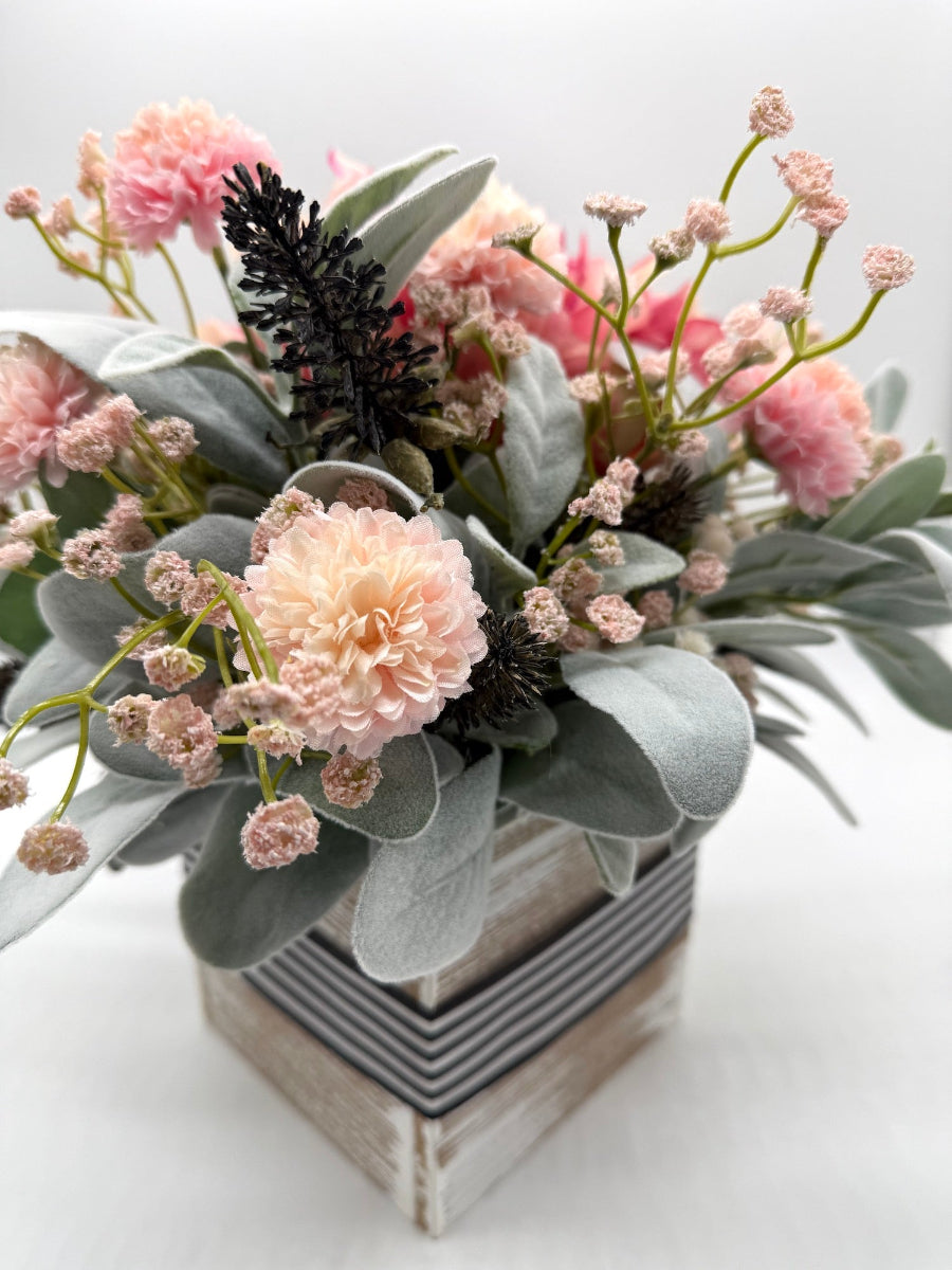 pink white green floral centerpiece in wooden square vase with ribbon