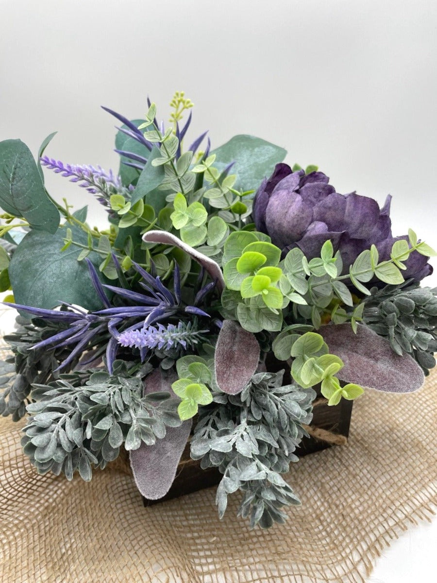 view from top Purple Floral Arrangement with variety of greenery from green to purple in wooden square planter stained with expresso color