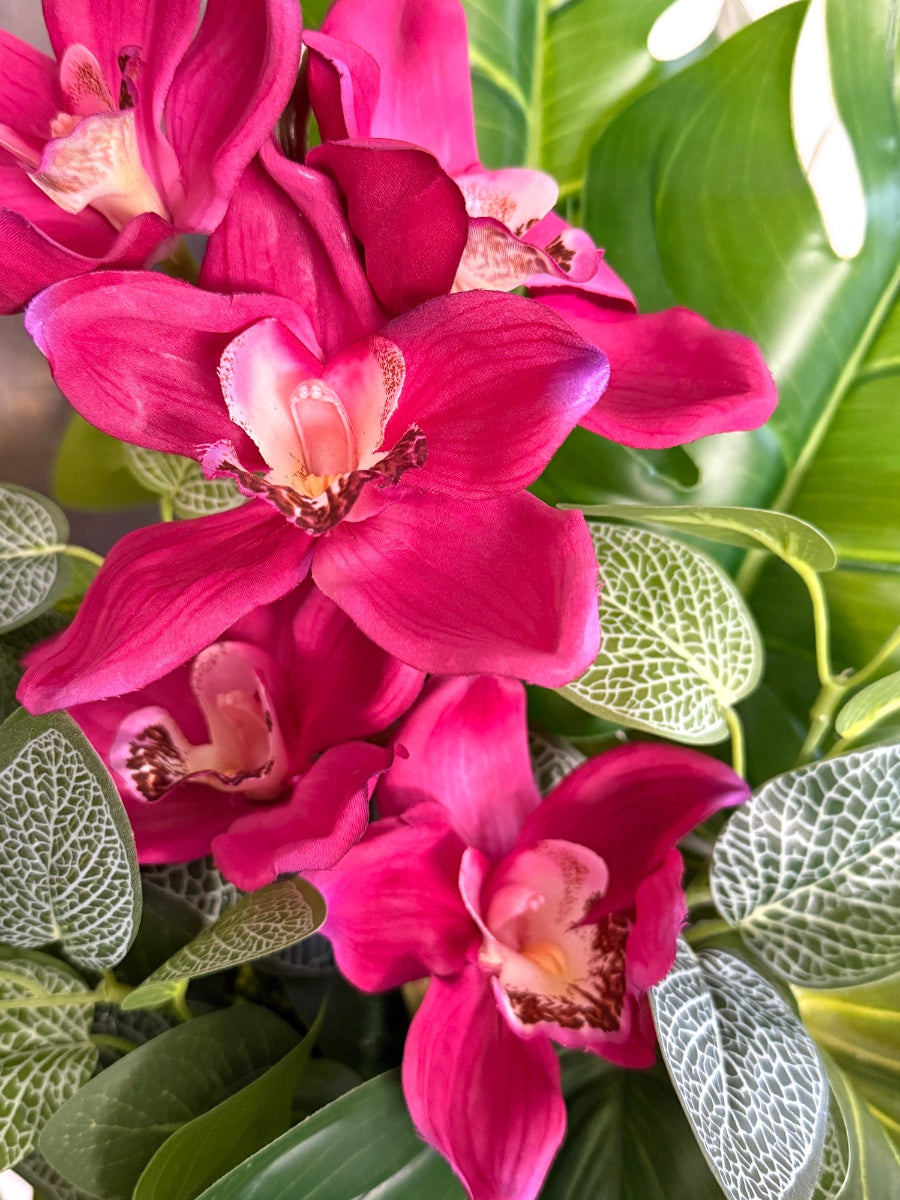 realistic looking pink orchid flower arrangement