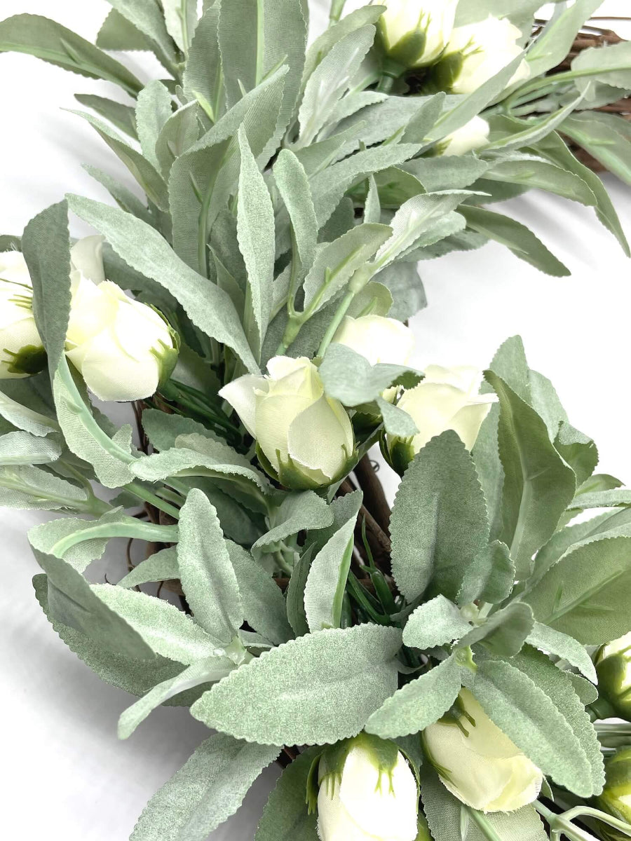 close up for faux sage wreath with ivory roses on grapevine base